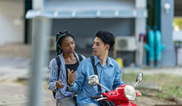istock Colleagues Commuting on an Electric Motorcycle 2189275019