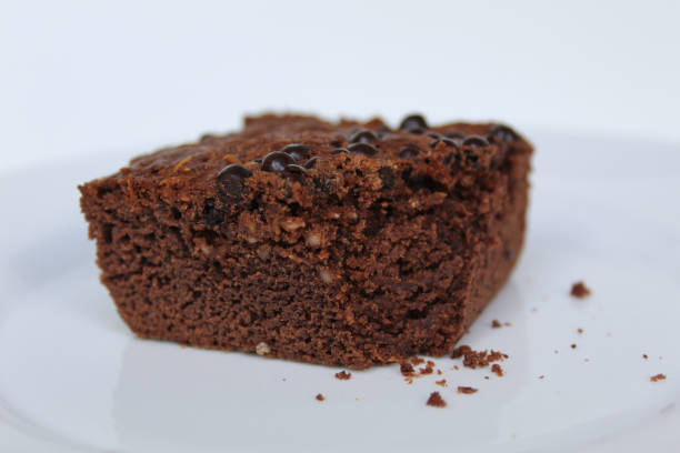 istock Square shape of brownies cake with choco chips topping, isolated on white background 2189275304