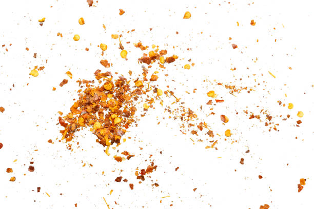 istock dried red chili pepper flakes and seeds isolated on white background 2189278049