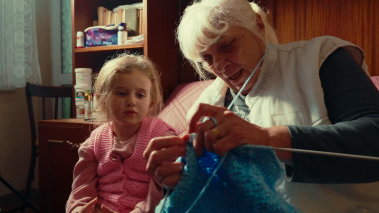 Grandma Teaches Her Granddaughter How To Knit