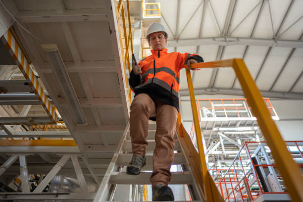 istock Woman Factory Worker in Large Scale Manufacturing 2189278740