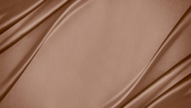 Black dark light pastel dusty pale soft chocolate coffee brown beige nude abstract background. Silk satin fabric. Curtain drapery line wave. Mocha moose color 2025. Flat lay, top view table.