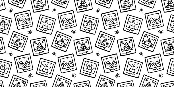 Cardspattern Doodle pattern of little photos with winter illustrations. Hand drawn pattern with set of cute illustrations in picture frames black and white photo christmas cards stock illustrations