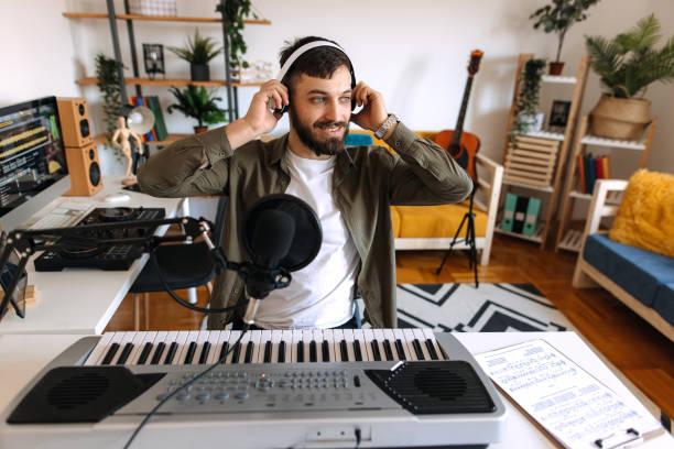 Male musician making music at home on piano