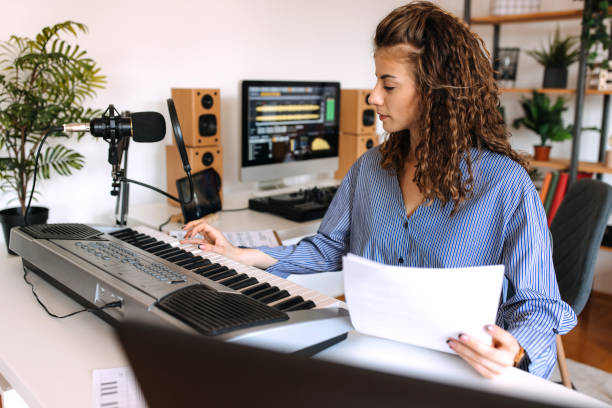 istock Woman enjoying playing electric piano 2189295609