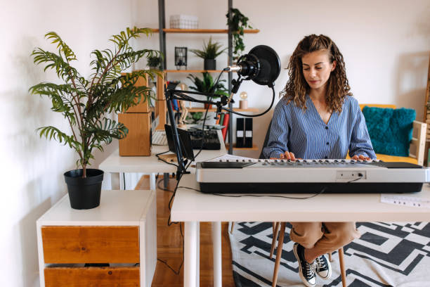 istock Woman enjoying playing electric piano 2189295663