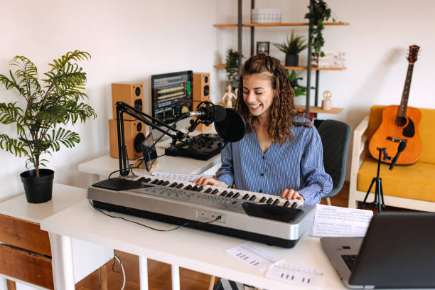 istock Woman enjoying playing electric piano 2189295730