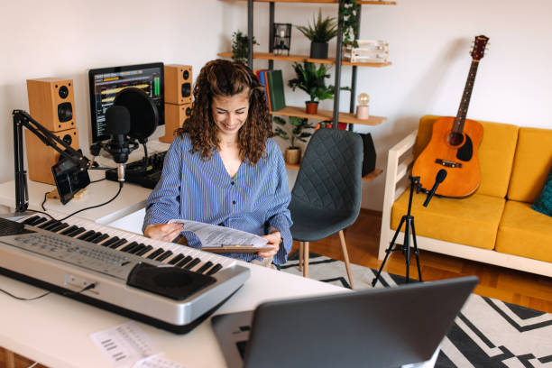 istock Woman enjoying playing electric piano 2189295773