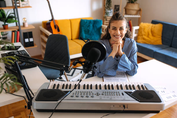 istock Woman enjoying playing electric piano 2189295890