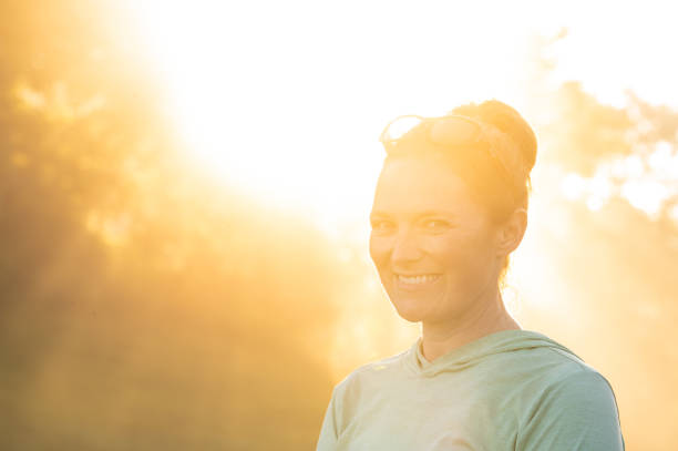 istock Bright Sun Backlights Woman Standing In Fog 2189299101