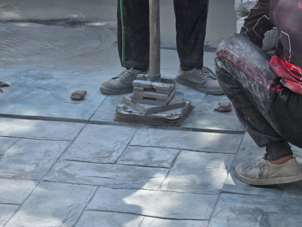Artisans craft stunning stamped concrete flooring in Pattaya, Thailand Pattaya, Thailand, skilled artisans are busy working on a stunning stamped concrete surface. The intricate patterns and textures come to life under their expert hands. Stamped Concrete Driveway Installation .