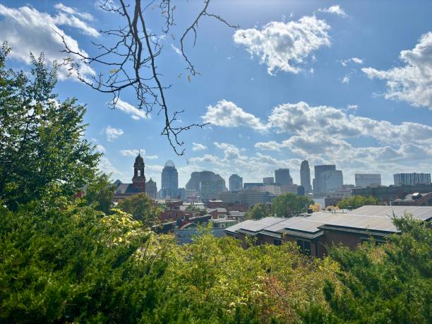 istock Cincinnati skyline skyline emerges from behind a lush canopy of trees 2189304148