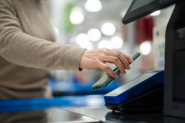 istock Asian women are using mobile phones to pay the bill. 2189307823