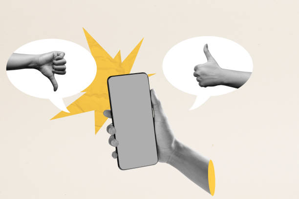 istock A human hand holding a mobile phone with two sides between thumb up and down gestures on a colored background 2189308372