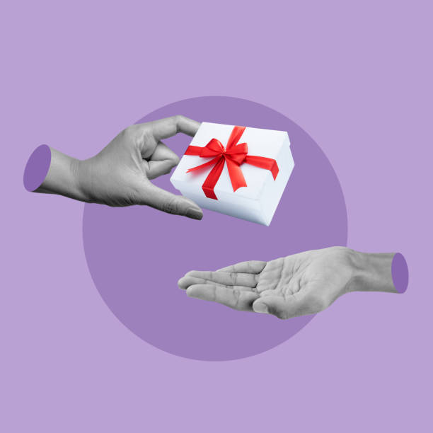 istock Human hand give gift boxes to other with colored background 2189310458