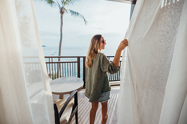 istock Woman Enjoying Ocean View from Balcony 2189314178