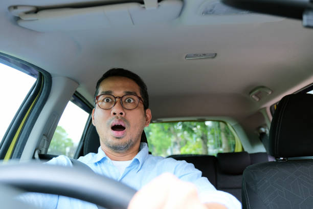istock A man showing shocked face expression when driving his car 2189325390