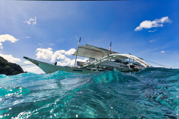 Filipino traditional small fishing boat at sea on the island of Coron in the Philippines.