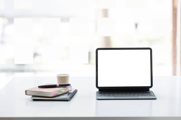 istock Digital tablet blank screen on the desk with coffee and book pencils at the office. 2189326076