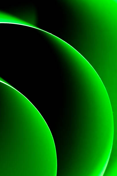 Colorful abstract curves in shades of green tints and black creating a dynamic visual experience
