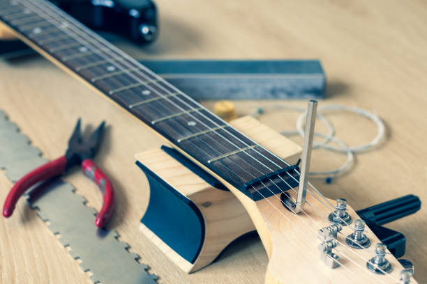 istock guitar repair, adjustment concept 2189326658