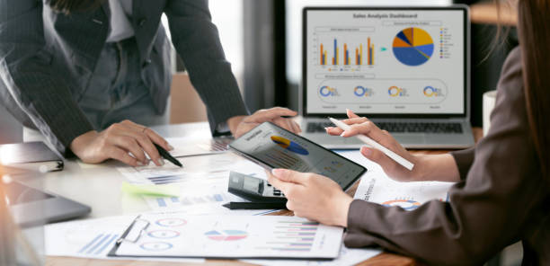 istock Business team meeting, discussing new plan financial graph data on office table with laptop and digital tablet, Finance, accounting, investment. 2189327834