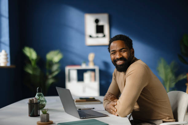 istock Happy black businessman enjoying while working in the office. 2189328333