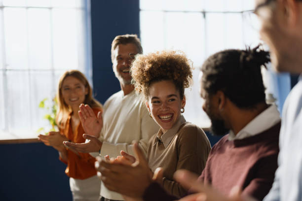 istock Happy entrepreneurs talking while applauding in the office. 2189330699