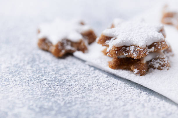 Christmas cookies (cinnamon stars) on bright background. Soft focus. Close up.
