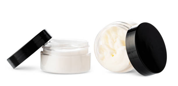istock Open cosmetic jars showcasing different creams set against a clean white background 2189331829