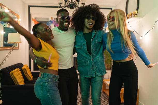 istock Young multiethnic friends group dancing at home party 2189333389