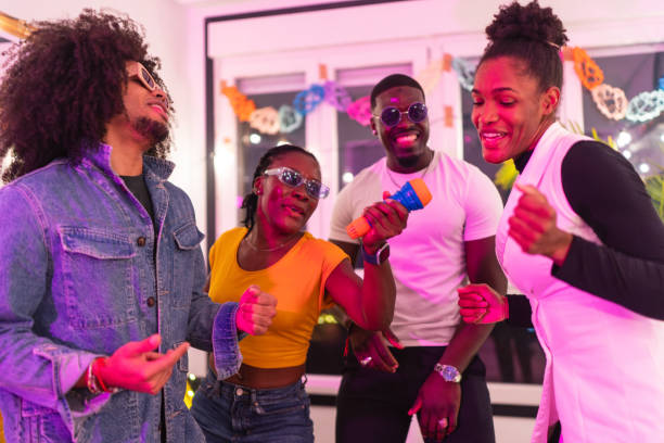 istock Friends singing karaoke at home party 2189333746
