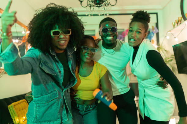 istock Young friends singing karaoke and having fun at home party 2189333755