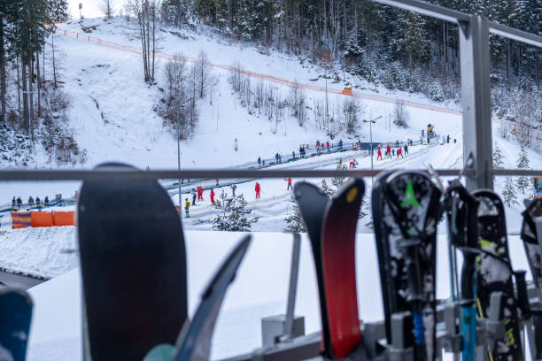 A group of press photographers and a television cameraman take photos at the podium ceremony at the 2024 Canmore Cross-Country Ski World Cup on February 13, 2024, at the Canmore Nordic Centre Provincial Park in Alberta, Canada. (John Gibson Photo/Gibson Pictures)