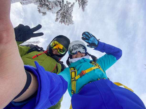 istock Couple Taking Selfie on Snowy Mountain 2189334689