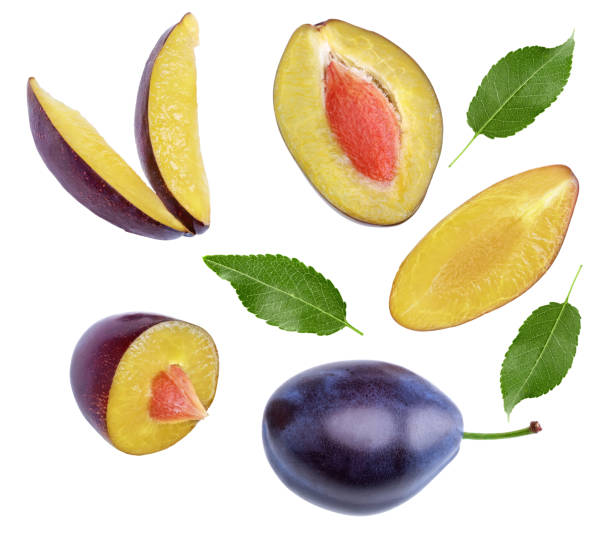 istock fresh plum fruit with green leaf and cut plum slices isolated on white background. clipping path 2189336425