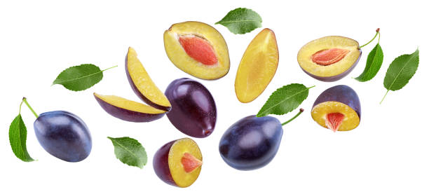 istock flying fresh plum fruit with green leaf and cut plum slices isolated on white background. clipping path 2189336503