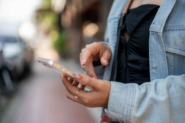 istock A tourist using her smartphone to check directions on an app while exploring the city. 2189337602