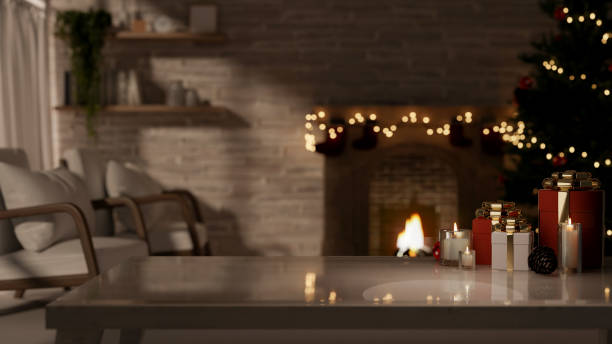 istock A coffee table in a cozy living room, illuminated by a glowing Christmas tree and a fireplace. 2189337793