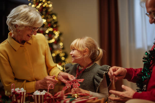 istock Family decorating presents for Christmas 2189338065