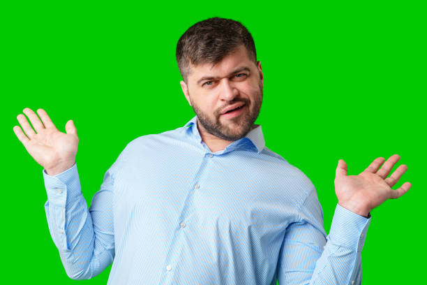 istock A man playfully posing with a quirky expression against a bright green background 2189338912