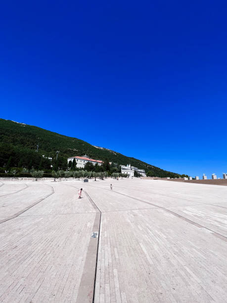 istock Vast empty plaza with clear blue sky and distant hills. San Giovanni Rotondo, Italy. 2189339178