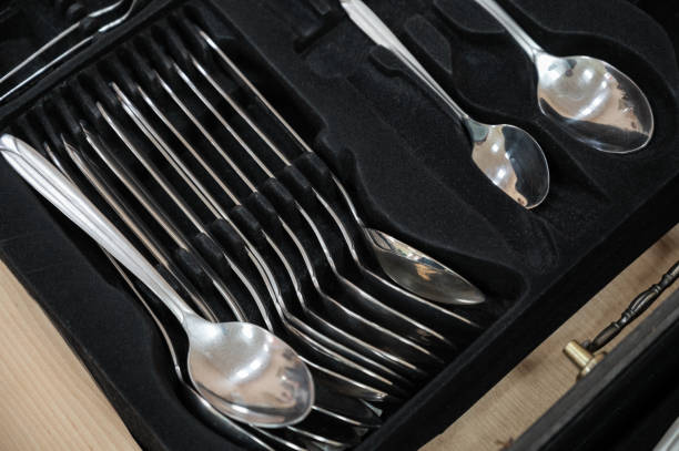 istock Set of stainless steel spoons in black case 2189340271