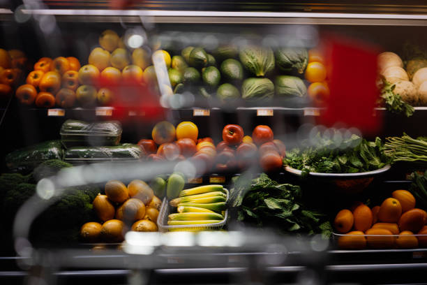istock Defocused shopping cart with fruit shelves in the background 2189341328