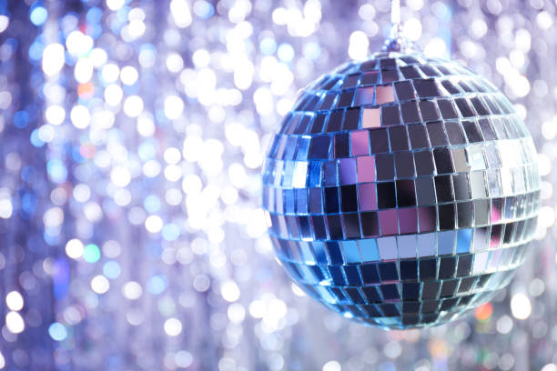 istock Disco ball with festive silver ribbons on background 2189341794