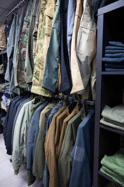istock Folded Tactical Clothing and Military Uniforms on Shelves 2189342111