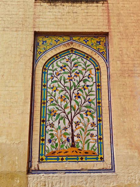 istock A vibrant wall mural features a detailed tree design with blossoms, framed in geometric patterns in an urban setting 2189344698