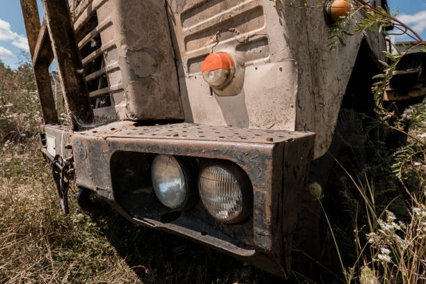 istock Abandoned Vintage Truck Front with Rust and Overgrown Vegetation 2189344706