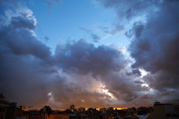 istock Blue sky at sunset twilight over city lights with heavy clouds 2189345203