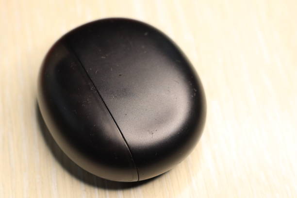istock Stylish Black Wireless Earbuds with a Charging Case for enhanced portability and convenience 2189345845